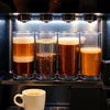 Atlantis coffee vending machine price in Delhi showing brewed coffee cups inside the machine
