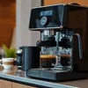 Atlantis tea coffee machine Sector 62 Noida black espresso maker brewing coffee on countertop