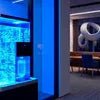 Atlantis coffee machine Noida water dispenser setup in modern office lounge area