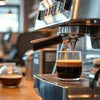 Atlantis Coffee Machine Sector 18 Noida brewing fresh espresso shot with coffee outlet and cup