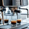 Atlantis Coffee Machine for rent brewing fresh espresso shots into glass cups