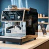 Atlantis coffee machine service Greater Noida with black commercial coffee maker on counter