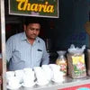Atlantis coffee machine Ghaziabad with packaged coffee and cups served by vendor