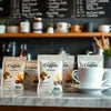 Atlantis machine in Crossings Republik coffee cups and sugar packets on café counter