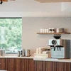 Tea coffee premix in Vaishali Ghaziabad displayed in a modern kitchen with coffee machine and cups