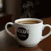 Coffee cup from vending machine service Noida with hot brewed coffee inside