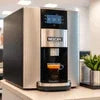 Corporate coffee machine Noida stainless steel model brewing fresh coffee in office setting