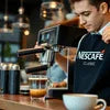 Nescafe coffee machine for factory Noida with barista preparing fresh espresso