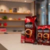 Nescafe Classic Coffee Dealer Gurugram packages displayed on a kitchen counter with coffee cups in the background