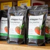 Amazon Plus Tea Premix 1kg Online packs displayed on wooden surface for easy purchase