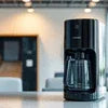 Black coffee machine on kitchen counter for Tea Coffee Machine Noida Sector 16