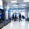 Nescafe coffee machine dealer in Gurugram showroom with vending machines and customers