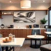 modern office coffee premix supplier kitchen with countertop, coffee machines, and seating area