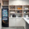 Nescafe vending machine for offices located in a modern office kitchen with coffee supplies