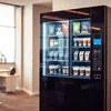 Modern vending machine stocked with snacks and beverages in a bright room