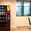 Tea coffee vending machine in office lounge offering hot beverage options