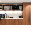 Automatic coffee machine PATNA model integrated in modern wooden kitchen setup
