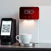 Nescafe coffee machine with QR payment in Delhi showing QR code scanner and coffee cup on counter