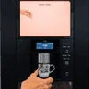 Office coffee vending machine in use with hand placing cup under dispenser for office coffee vending solutions Delhi