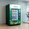 Atlantis tea premix vending machine Noida with beverage selection in office setting