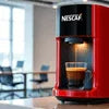 Nescafe Atlantis coffee machine dealer red model brewing fresh coffee in kitchen