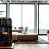 Modern Atlantis vending machine price model in a spacious office lounge area with natural light