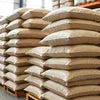 Atlantis vending machine Noida Sector 62 bags of raw material stacked in warehouse for vending machine use