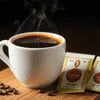 Top coffee premix for offices 2024 with steaming hot cup and premix sachets on wooden surface