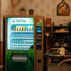 cafe tea vending machine Idarpuram green model in cozy cafe setting with shelves and decor