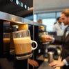 coffee machine preparing a fresh cup of coffee by best coffee premix distributor Delhi