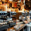Coffee machine distributor Idarpuram showcasing multiple professional coffee machines in a cafe setting