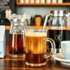 Best coffee vending machines Delhi serving fresh coffee in glass cups with syrup and milk bottles