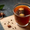 Atlantis vending machine on rent in Delhi serving hot spiced tea in a glass cup with star anise