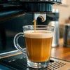 Atlantis coffee machine for business use brewing fresh espresso into clear glass cup