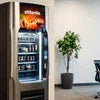 Atlantis instant vending solution for offices with stocked beverage and snack options in modern office setting