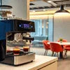Atlantis coffee vending franchise Delhi branded coffee machine setup in modern office pantry