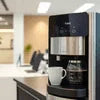 Atlantis coffee machine for canteens brewing fresh coffee in office kitchen setting
