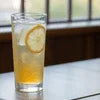 Atlantis vending machine near me Sector 60 Noida serving refreshing iced lemon tea in a clear glass