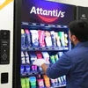 Atlantis coffee machine dealer near me Sector 67 Noida vending machine with various coffee products and a customer selecting