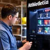 Technician providing coffee machine service in Ghaziabad checking vending machine functionality