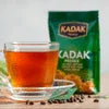 Atlantis Kadak tea premix 1kg price displayed with a cup of brewed tea and packaging