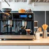 Atlantis coffee machine supplier Noida espresso machine setup with grinder and coffee accessories on counter