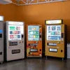 Coffee vending machine dealer Gurgaon showcasing three modern vending machines with coffee and snack options