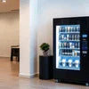 Atlantis coffee vending machine with a variety of beverages in a modern office setting