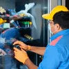 Technician repairing coffee vending machine repair Tripura for office use