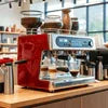 Red espresso coffee machine with dual portafilters for office coffee vending