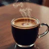 Coffee machine for office brewing fresh hot coffee in a clear glass cup