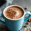 Cup of rich hot chocolate made with the best hot chocolate premix in Gurugram topped with cocoa powder