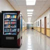 Vending machines for schools in Delhi placed in a bright hallway stocked with snacks and drinks
