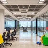 Modern office interior with desks and chairs showcasing janitorial supplies in Noida for clean workspaces
